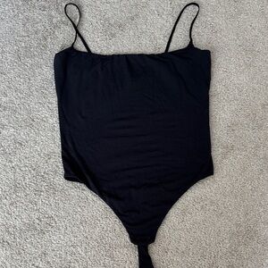 Skims body suit. Black. Size Lg. EUC